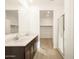 Bathroom with double vanity, large mirror and walk-in shower at 9121 N 173Rd Ln, Waddell, AZ 85355