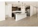 Modern kitchen with dark cabinetry and granite countertops at 9121 N 173Rd Ln, Waddell, AZ 85355