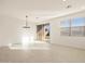 Dining room with chandelier and sliding glass door at 9127 N 173Rd Ln, Waddell, AZ 85355