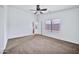 Bright bedroom with a ceiling fan and window blinds at 10813 W Piute Ave, Sun City, AZ 85373