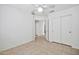 Simple bedroom with double door closet and tile floor at 10813 W Piute Ave, Sun City, AZ 85373