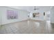 Living room with tile floors, large windows and ceiling fan at 10813 W Piute Ave, Sun City, AZ 85373