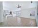 Spacious living room featuring tile floors and a ceiling fan at 10813 W Piute Ave, Sun City, AZ 85373