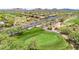 Aerial view of a golf course community with homes and streets at 2740 W Plum Hollow Dr, Anthem, AZ 85086