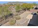 Desert backyard featuring natural landscaping and wrought iron fence, with mountain views at 2740 W Plum Hollow Dr, Anthem, AZ 85086