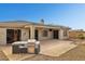 Backyard featuring built-in barbecue area and desert landscaping at 2740 W Plum Hollow Dr, Anthem, AZ 85086