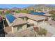 Top down aerial view of a home with a brown tile roof and solar panels installed at 2740 W Plum Hollow Dr, Anthem, AZ 85086