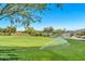 Beautiful view of the golf course with sprinklers and trees at 2740 W Plum Hollow Dr, Anthem, AZ 85086