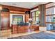 Charming reception area with wood paneling, a granite countertop, and natural light from a large window at 2740 W Plum Hollow Dr, Anthem, AZ 85086