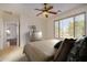 Bedroom with backyard view and ceiling fan at 30341 N Saddlebag Ln, San Tan Valley, AZ 85143