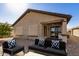 Backyard view showcasing the home's exterior and patio at 30341 N Saddlebag Ln, San Tan Valley, AZ 85143