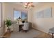 Bright and airy home office with a desk and comfortable chair at 30341 N Saddlebag Ln, San Tan Valley, AZ 85143