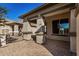 Covered patio with brick pavers and access to the backyard at 30341 N Saddlebag Ln, San Tan Valley, AZ 85143