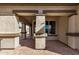 Covered patio with brick pavers adjacent to the house at 30341 N Saddlebag Ln, San Tan Valley, AZ 85143