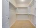 Large walk-in closet with ample shelving at 30341 N Saddlebag Ln, San Tan Valley, AZ 85143