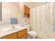 Small bathroom with shower, toilet, and wood vanity at 4850 W Erie St, Chandler, AZ 85226