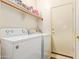 Bright laundry room with washer, dryer, and ample storage at 4850 W Erie St, Chandler, AZ 85226