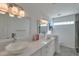 Modern bathroom with double sinks, updated vanity, and a large mirror at 7777 E 2Nd St # 303, Scottsdale, AZ 85251