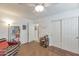 Cozy bedroom with wood floors, built-in shelving, and a comfortable seating area at 7777 E 2Nd St # 303, Scottsdale, AZ 85251