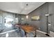 Elegant dining room with a long wooden table and gray walls at 7777 E 2Nd St # 303, Scottsdale, AZ 85251