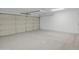 This is an image of a clean, empty two car garage with a white door at 10810 W Torren Dr, Arizona City, AZ 85123