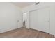 Neutral bedroom with closet, entrance to hallway and stairs at 14862 W Laurel Ln, Surprise, AZ 85379