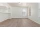 Open living room featuring tile floors, and abundant natural light through the windows at 14862 W Laurel Ln, Surprise, AZ 85379