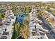 Aerial view of community, highlighting the lake and homes at 2232 W Lindner Ave # 44, Mesa, AZ 85202