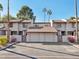 Two-story townhome with attached two-car garage and desert landscaping at 2232 W Lindner Ave # 44, Mesa, AZ 85202