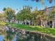 Townhome community featuring a serene canal view and lush greenery at 2232 W Lindner Ave # 44, Mesa, AZ 85202