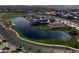 Aerial view of community lake and recreation area with walking paths and modern features at 23079 E Stacey Rd, Queen Creek, AZ 85142