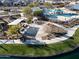 Aerial view of community park with walking path, playground, and pool in the background at 23079 E Stacey Rd, Queen Creek, AZ 85142