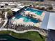 Aerial view of community pool and lounge area with shade coverings and modern features at 23079 E Stacey Rd, Queen Creek, AZ 85142