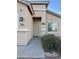 Front entry with a security door and small shrubs at 805 W Sunset Dr, Coolidge, AZ 85128