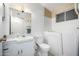 Bathroom with walk-in bathtub and updated vanity at 10434 W Oakmont Dr, Sun City, AZ 85351