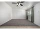 Spacious living room with carpet flooring and a large window at 10434 W Oakmont Dr, Sun City, AZ 85351