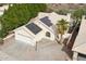 Single-story home with solar panels, a two-car garage, and a desert landscape at 12075 N 110Th St, Scottsdale, AZ 85259