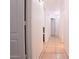 Clean hallway with light tile floors and neutral walls at 15881 W Moreland W St, Goodyear, AZ 85338