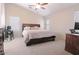 Spacious main bedroom with a king-size bed and an ensuite bathroom at 15881 W Moreland W St, Goodyear, AZ 85338