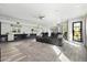 Bright, open-concept living room with a modern kitchenette and a large seating area for entertaining at 5311 N Palo Cristi Rd, Paradise Valley, AZ 85253