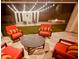 Evening view of backyard patio with fire pit, seating area, and string lights at 7369 W Cactus Wren Way, Florence, AZ 85132