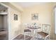 Small breakfast nook with white table and chairs at 10606 W Granada Dr, Sun City, AZ 85373