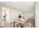 Dining area with a wood table and chairs, near kitchen at 10606 W Granada Dr, Sun City, AZ 85373