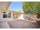 Private patio with brick pavers and a mature citrus tree at 10606 W Granada Dr, Sun City, AZ 85373