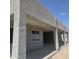 Modern, stucco exterior of home featuring covered patios, offering shade and outdoor living space at 1907 W Brooke Ln, Queen Creek, AZ 85144