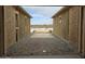 Framing of a new home's garage with view of a car and desert landscape at 1907 W Brooke Ln, Queen Creek, AZ 85144