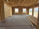 Interior framing of a new home's garage, showing the open space at 1907 W Brooke Ln, Queen Creek, AZ 85144