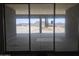 View through sliding glass doors onto a desert landscape at 1907 W Brooke Ln, Queen Creek, AZ 85144