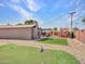 Large backyard with putting green, outdoor bar, and covered seating area, great for outdoor entertaining at 8450 E Montecito Ave, Scottsdale, AZ 85251