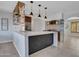 Stylish kitchen featuring an island, stainless steel appliances, and modern pendant lighting at 8450 E Montecito Ave, Scottsdale, AZ 85251